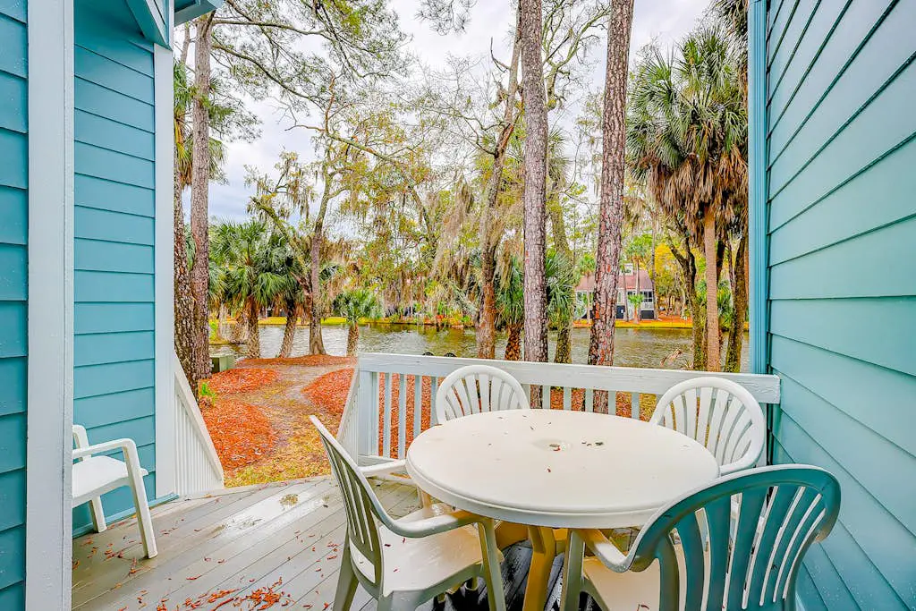 Coastal townhome with riverfront views, deck, & W/D - pool and athletic courts