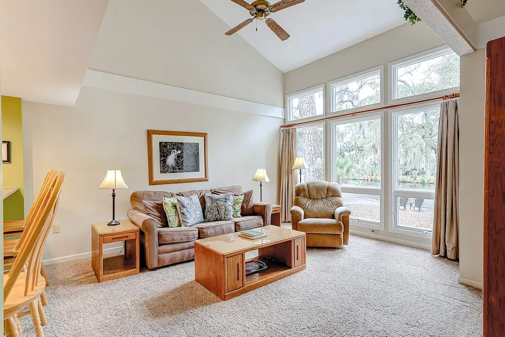 Coastal townhome with riverfront views, deck, & W/D - pool and athletic courts