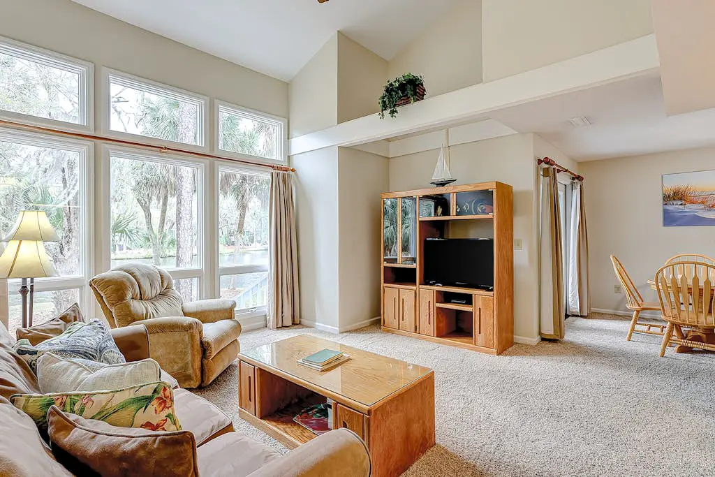 Coastal townhome with riverfront views, deck, & W/D - pool and athletic courts