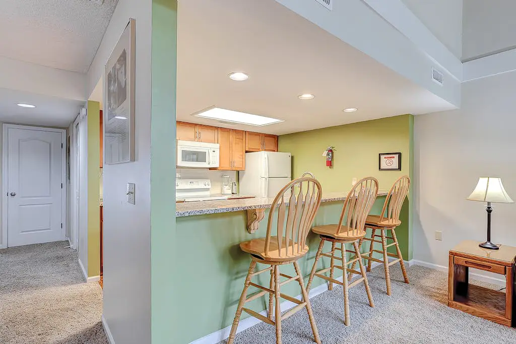 Coastal townhome with riverfront views, deck, & W/D - pool and athletic courts