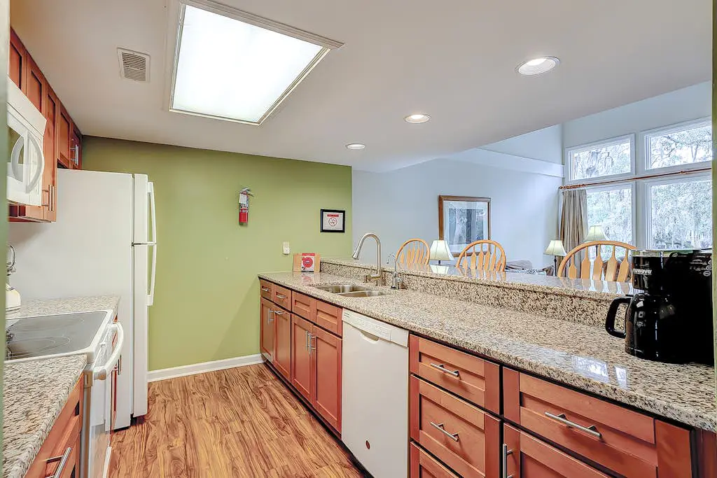 Coastal townhome with riverfront views, deck, & W/D - pool and athletic courts