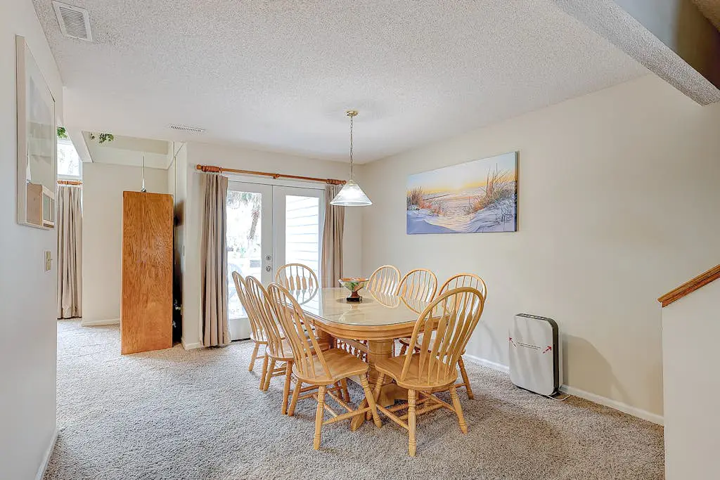 Coastal townhome with riverfront views, deck, & W/D - pool and athletic courts