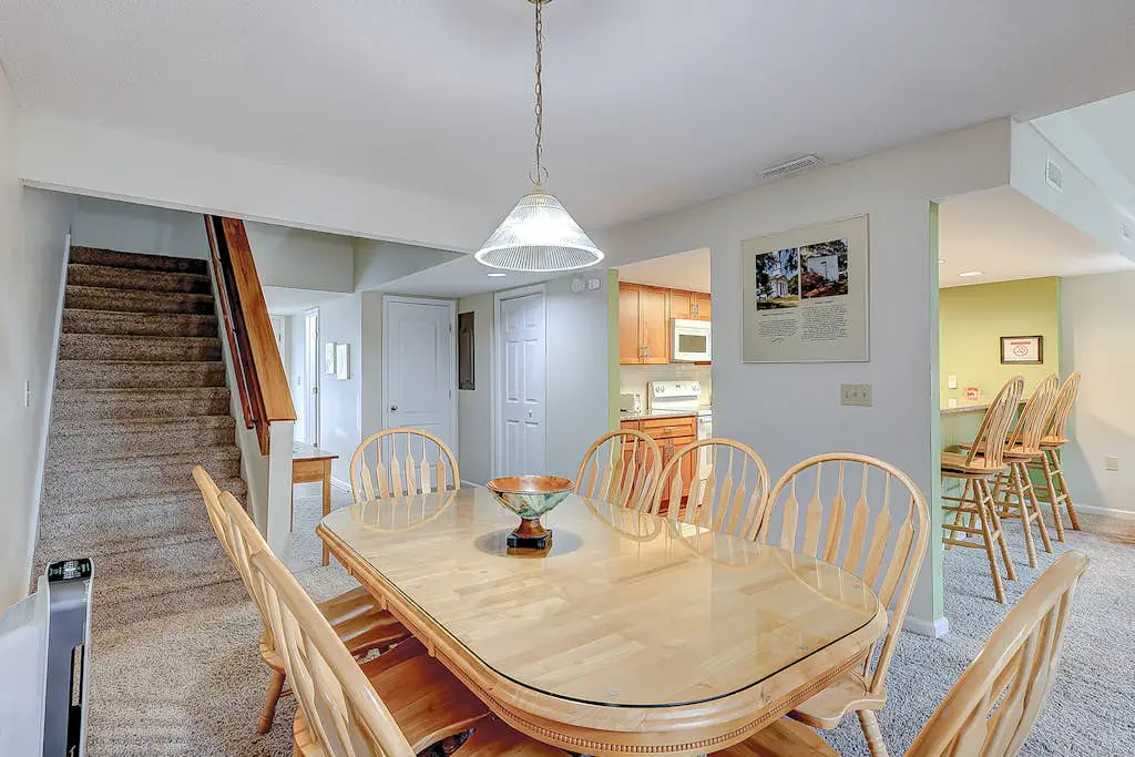 Coastal townhome with riverfront views, deck, & W/D - pool and athletic courts