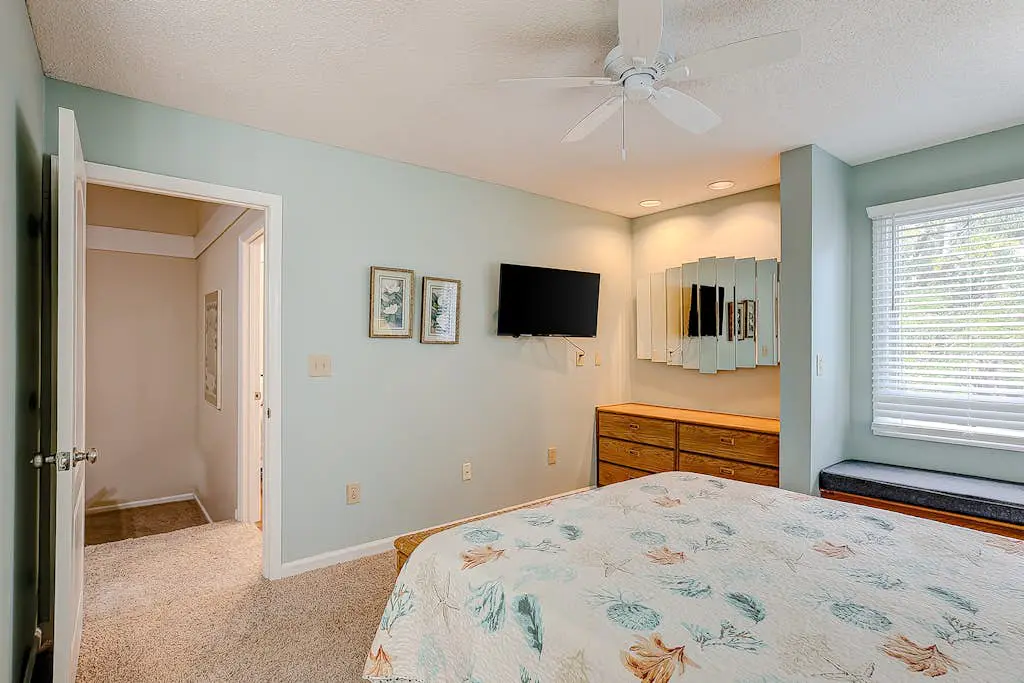 Coastal townhome with riverfront views, deck, & W/D - pool and athletic courts