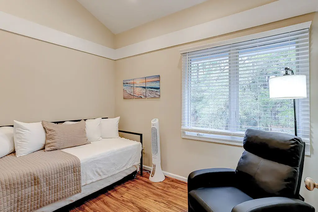 Coastal townhome with riverfront views, deck, & W/D - pool and athletic courts