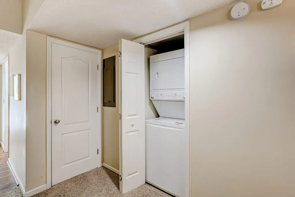 Coastal townhome with riverfront views, deck, & W/D - pool and athletic courts