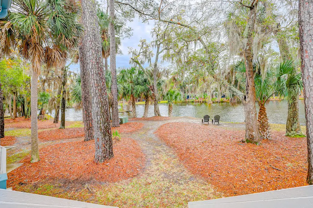 Coastal townhome with riverfront views, deck, & W/D - pool and athletic courts
