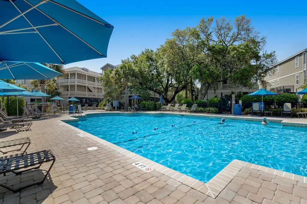 Coastal townhome with riverfront views, deck, & W/D - pool and athletic courts