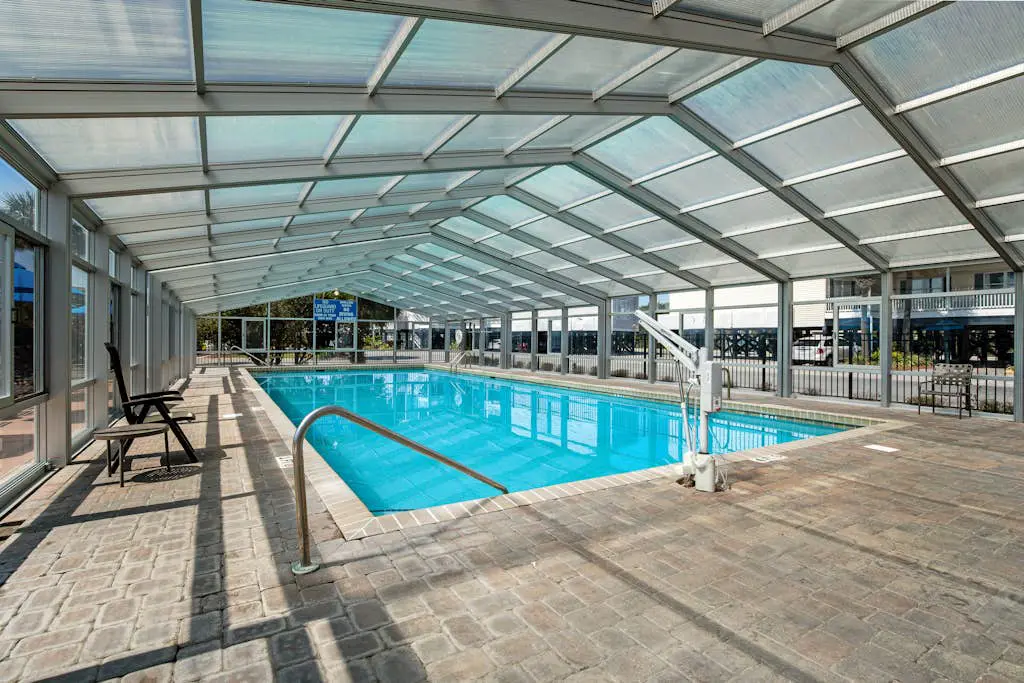 Coastal townhome with riverfront views, deck, & W/D - pool and athletic courts