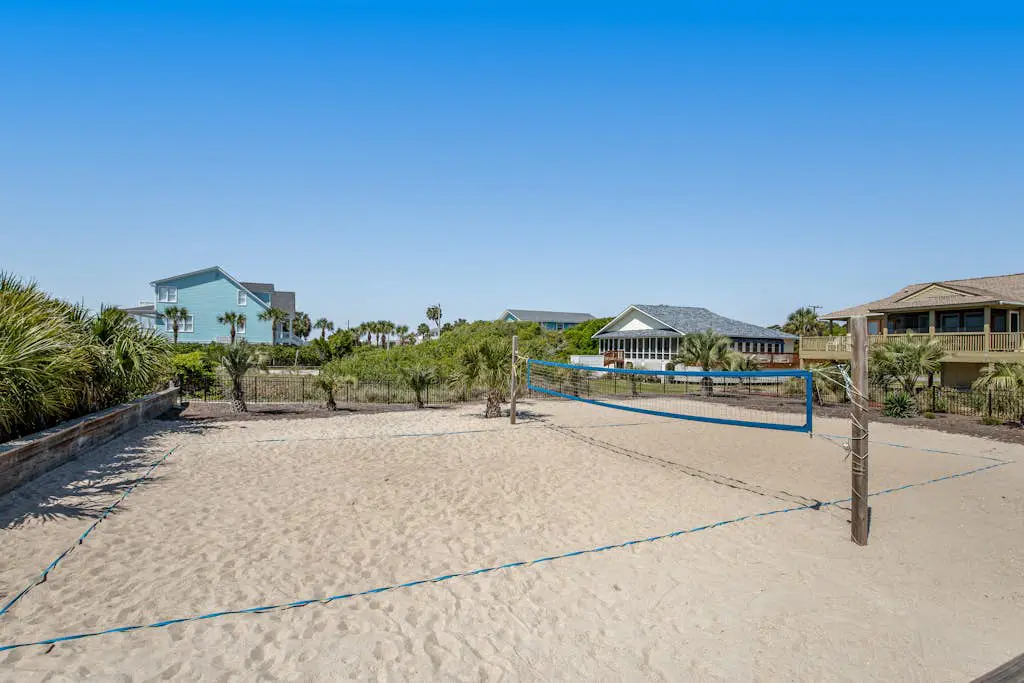 Coastal townhome with riverfront views, deck, & W/D - pool and athletic courts