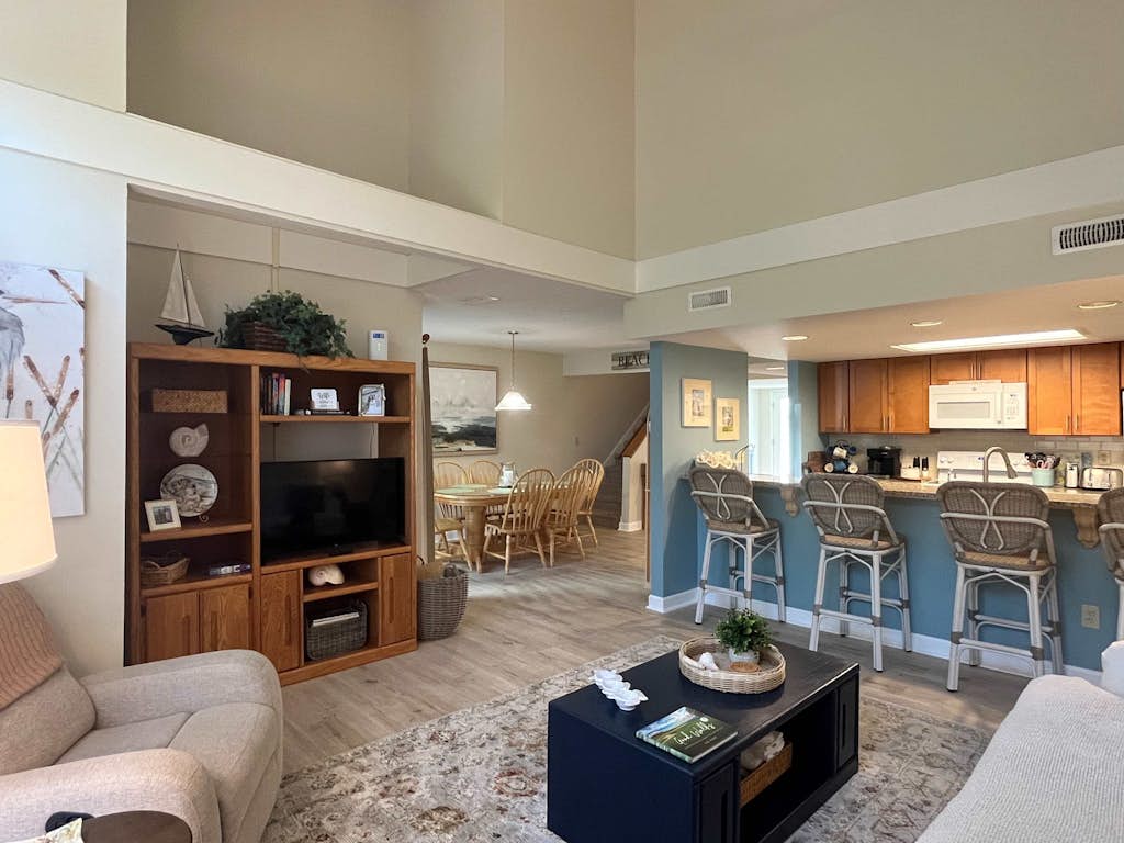 Coastal townhome with riverfront views, deck, & W/D - pool and athletic courts