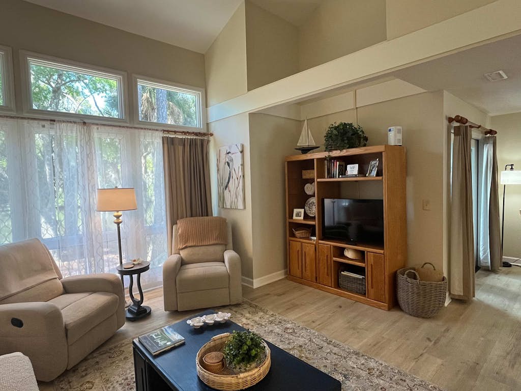 Coastal townhome with riverfront views, deck, & W/D - pool and athletic courts