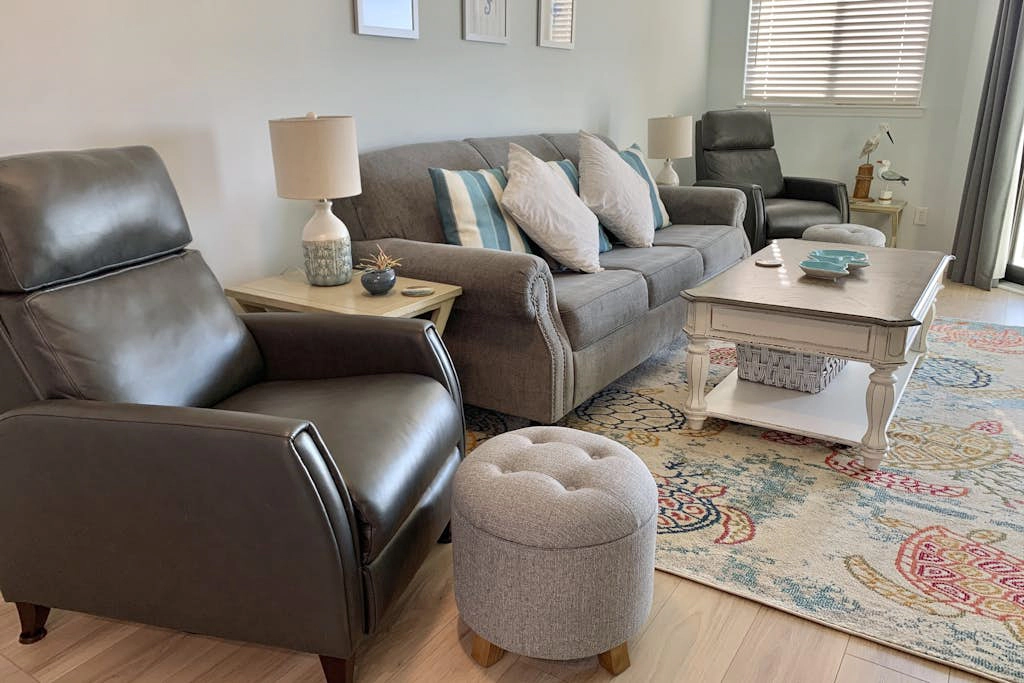 Inviting waterfront condo with marsh view, shared pool, balcony & central AC