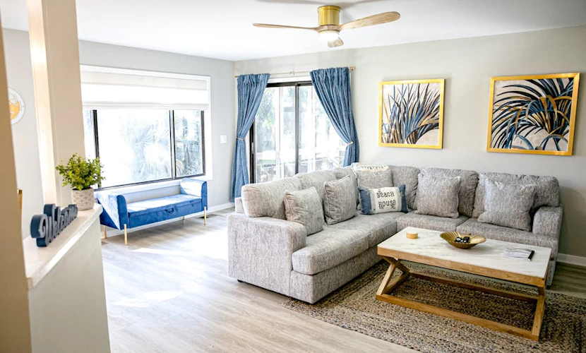 Golf course adjacent, beach-themed condo with sunroom, washer/dryer, & AC