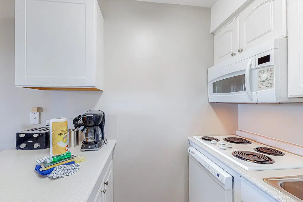 Condo with Coligny Beach views, outdoor pool, beach access, balcony, W/D, & AC