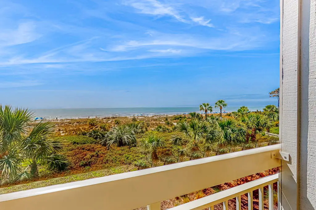 Condo with Coligny Beach views, outdoor pool, beach access, balcony, W/D, & AC