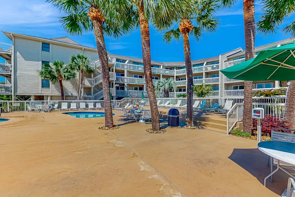 Condo with Coligny Beach views, outdoor pool, beach access, balcony, W/D, & AC
