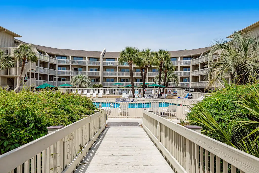 Condo with Coligny Beach views, outdoor pool, beach access, balcony, W/D, & AC