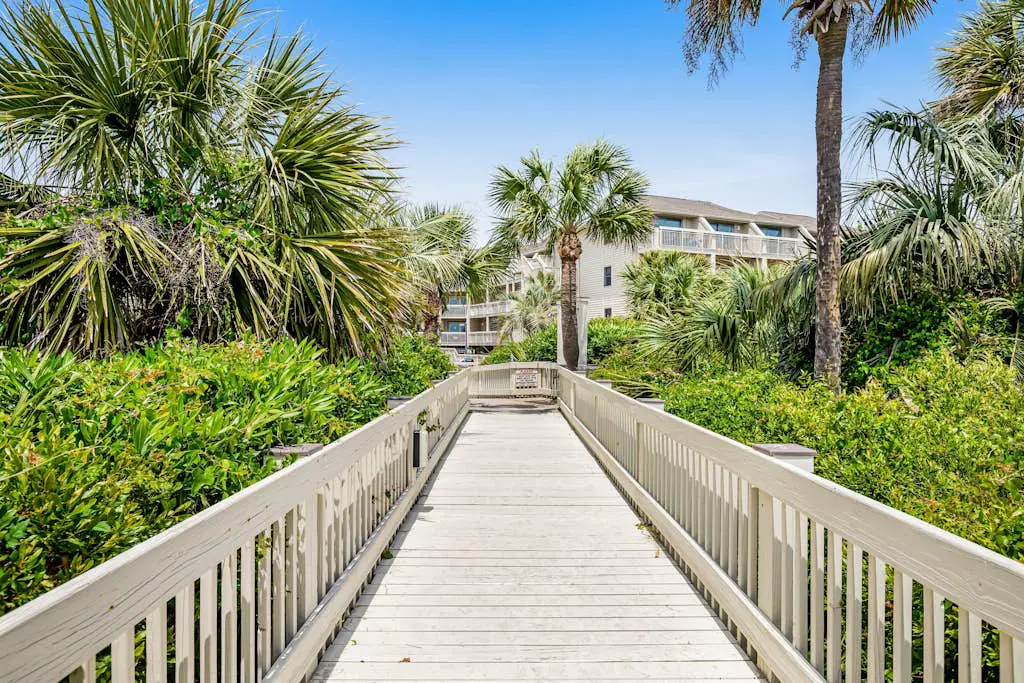 Condo with Coligny Beach views, outdoor pool, beach access, balcony, W/D, & AC