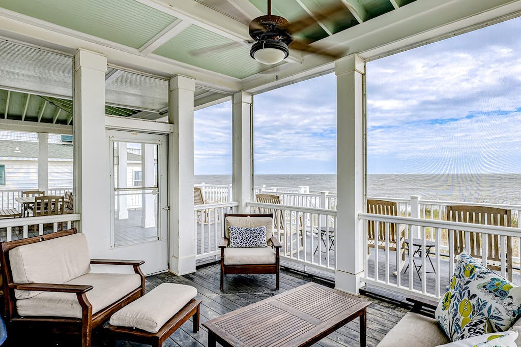 Luxe oceanfront home with dazzling beach views, screened porch & elevator