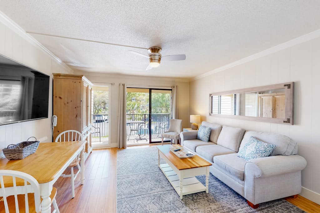 Inviting condo with pool, tennis, balcony, central AC, & W/D