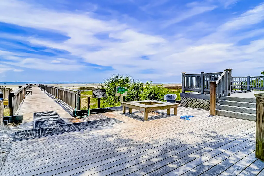 Second-floor condo in beachfront complex with pools, tennis & gym