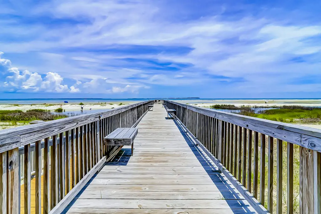Second-floor condo in beachfront complex with pools, tennis & gym