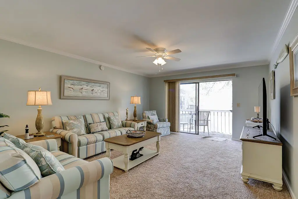 Waterfront condo with seasonal pools, hot tub, balcony, AC, & W/D