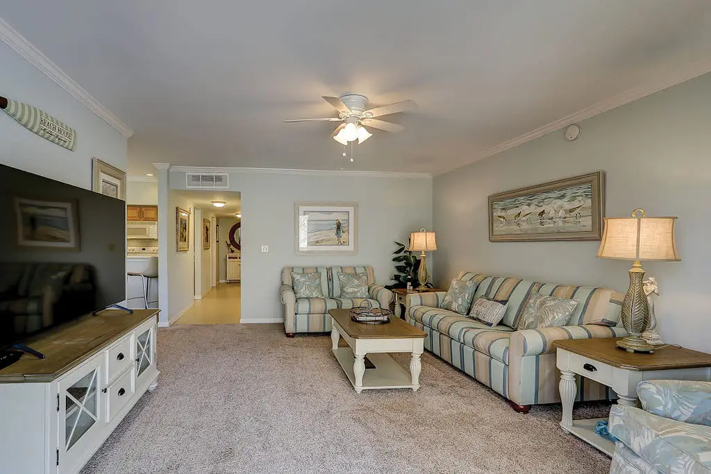 Waterfront condo with seasonal pools, hot tub, balcony, AC, & WD