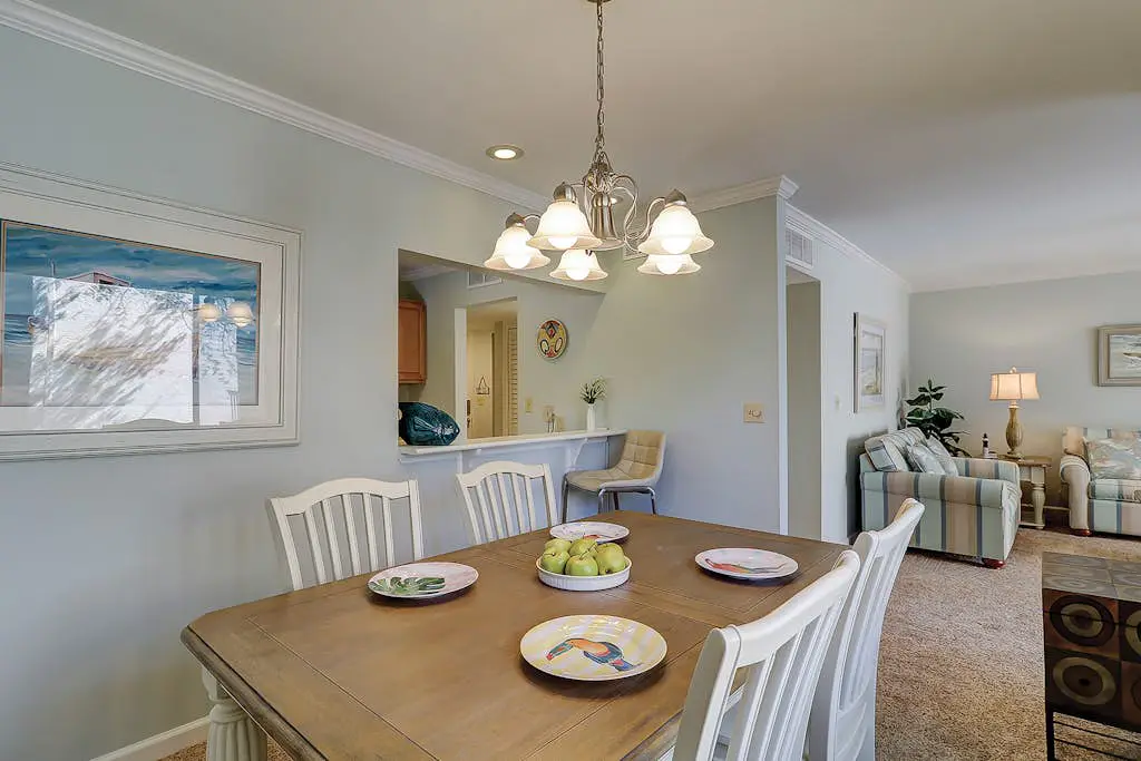 Waterfront condo with seasonal pools, hot tub, balcony, AC, & WD