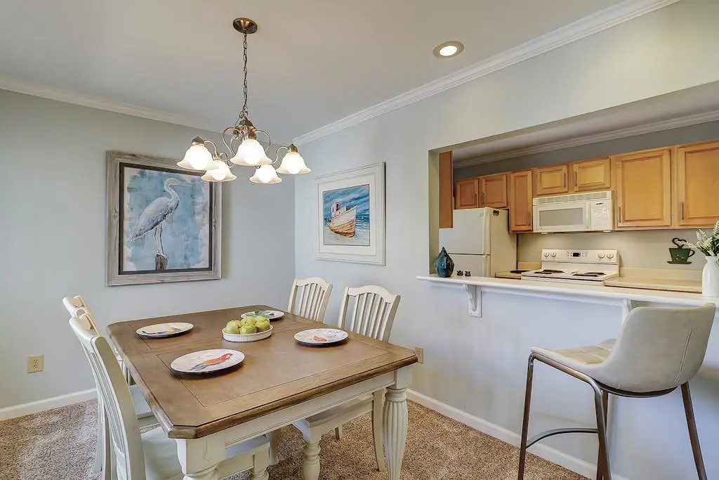 Waterfront condo with seasonal pools, hot tub, balcony, AC, & WD