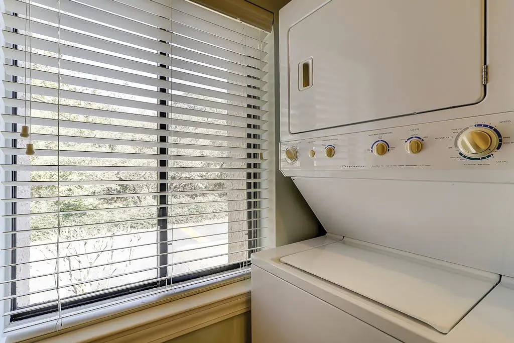 Waterfront condo with seasonal pools, hot tub, balcony, AC, & WD