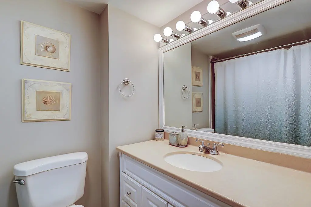 Waterfront condo with seasonal pools, hot tub, balcony, AC, & WD