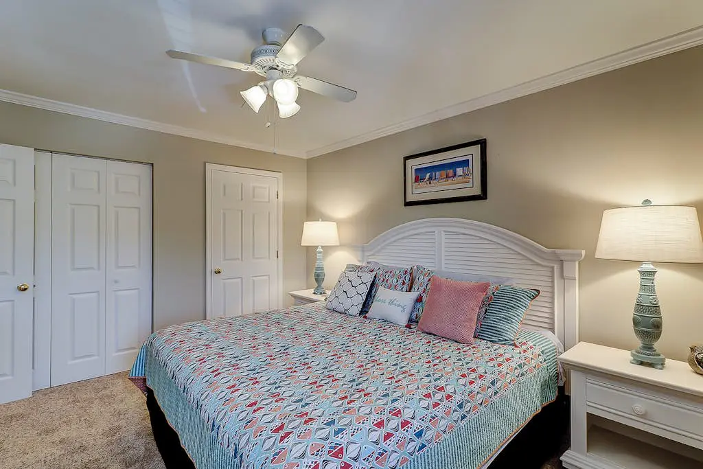 Waterfront condo with seasonal pools, hot tub, balcony, AC, & WD