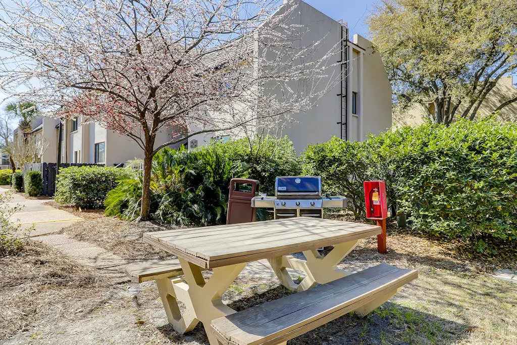 Waterfront condo with seasonal pools, hot tub, balcony, AC, & WD