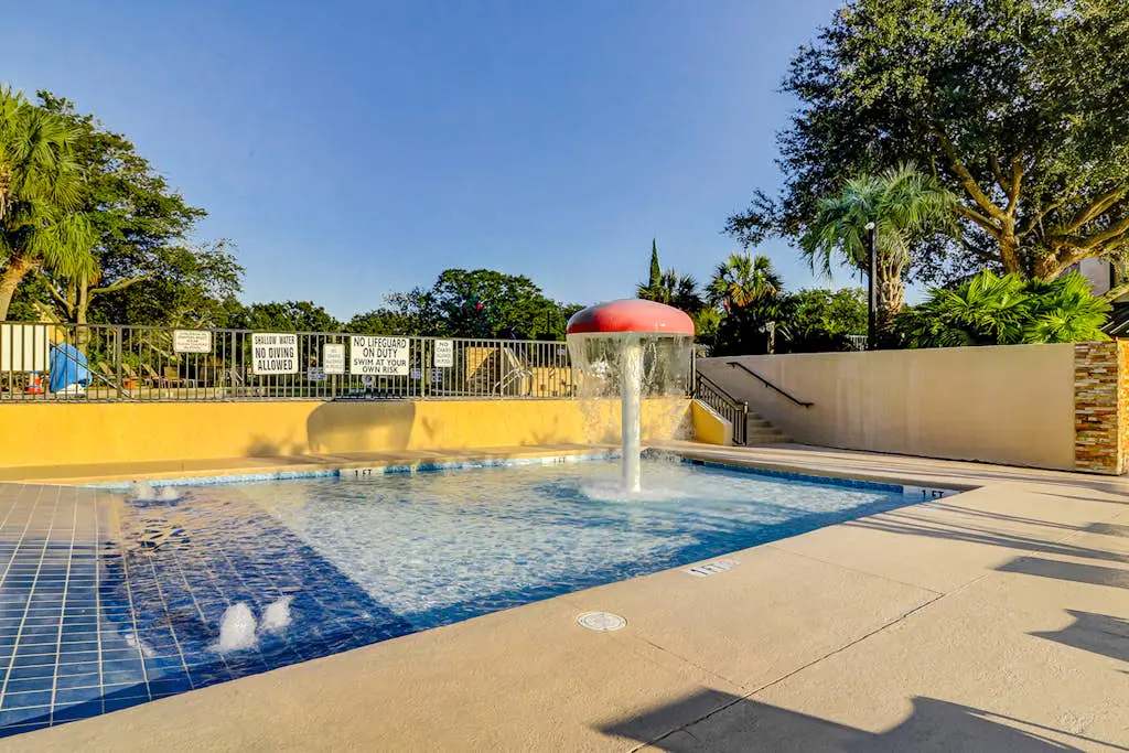 Waterfront condo with seasonal pools, hot tub, balcony, AC, & WD