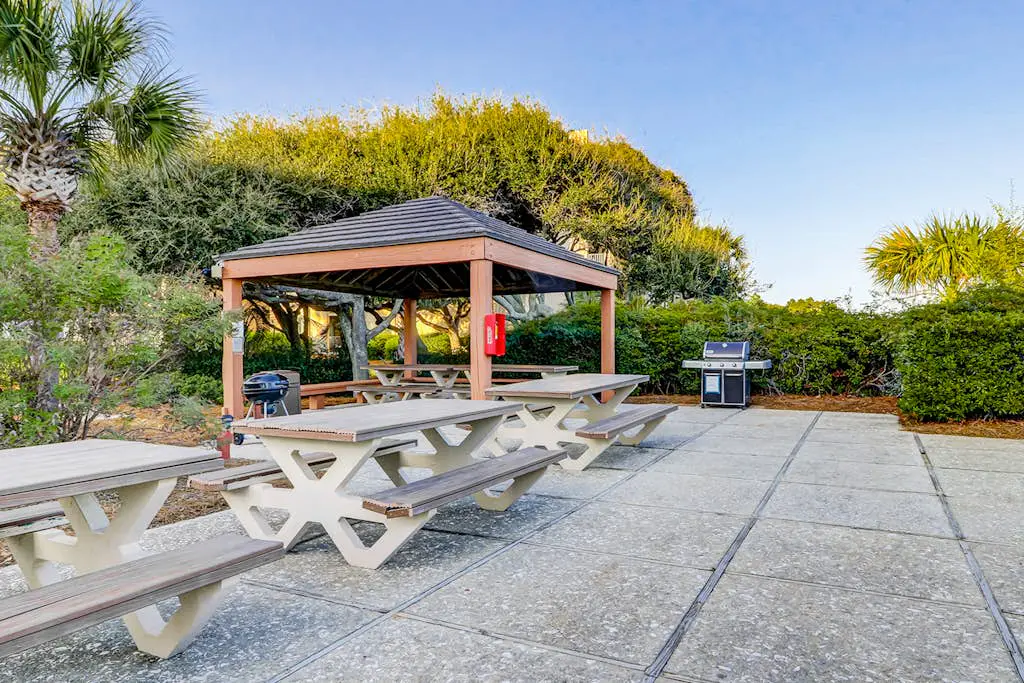 Waterfront condo with seasonal pools, hot tub, balcony, AC, & WD