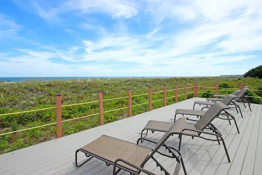 Waterfront condo with seasonal pools, hot tub, balcony, AC, & WD