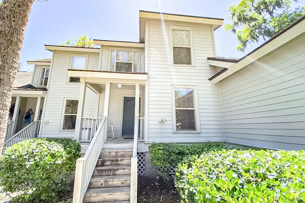 Water-view condo with covered deck, on-site golf, AC, & W/D - close to beach