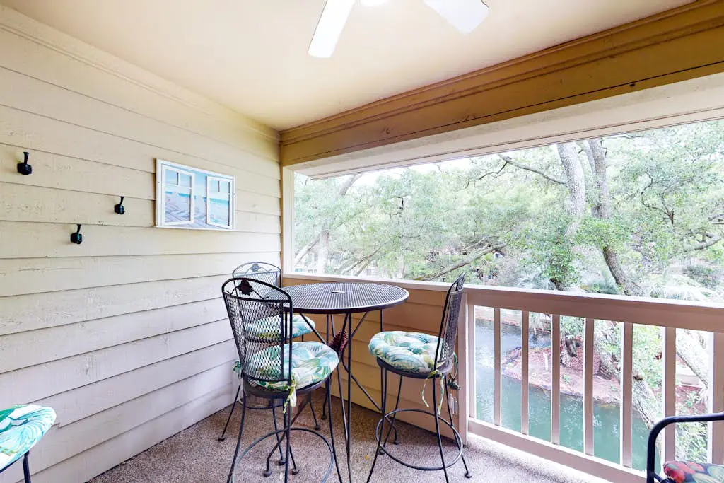 3rd-floor condo with water views, balcony, pools, gym, & beach access