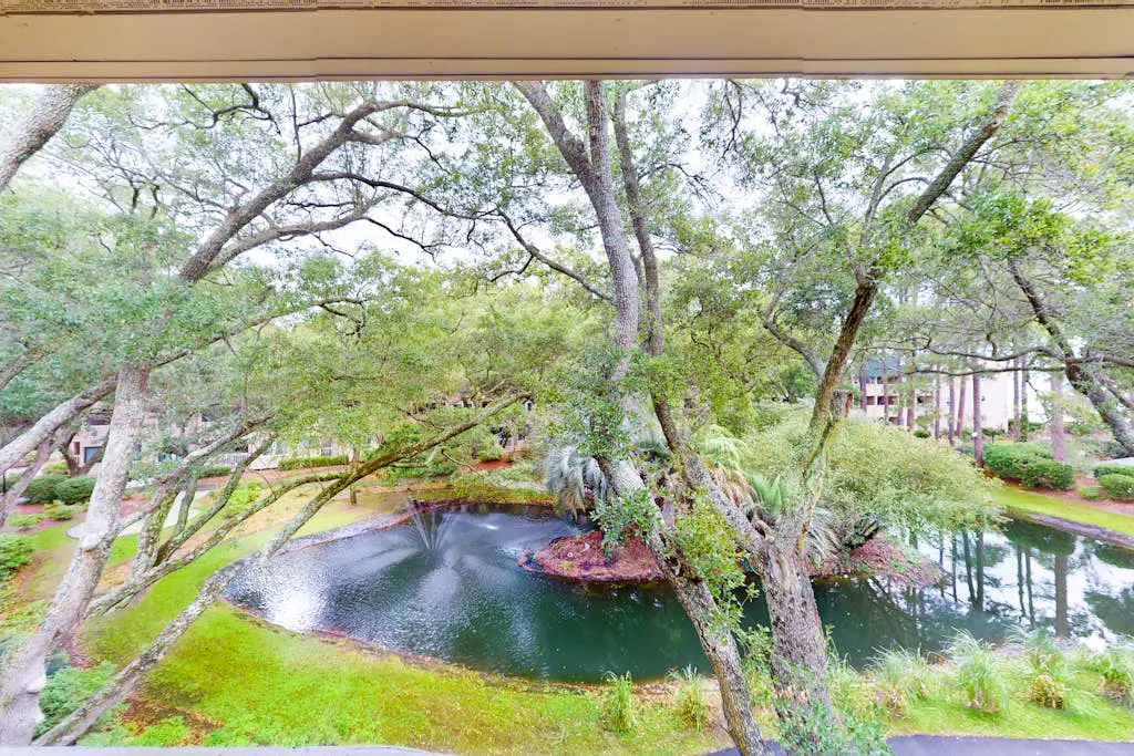 3rd-floor condo with water views, balcony, pools, gym, & beach access