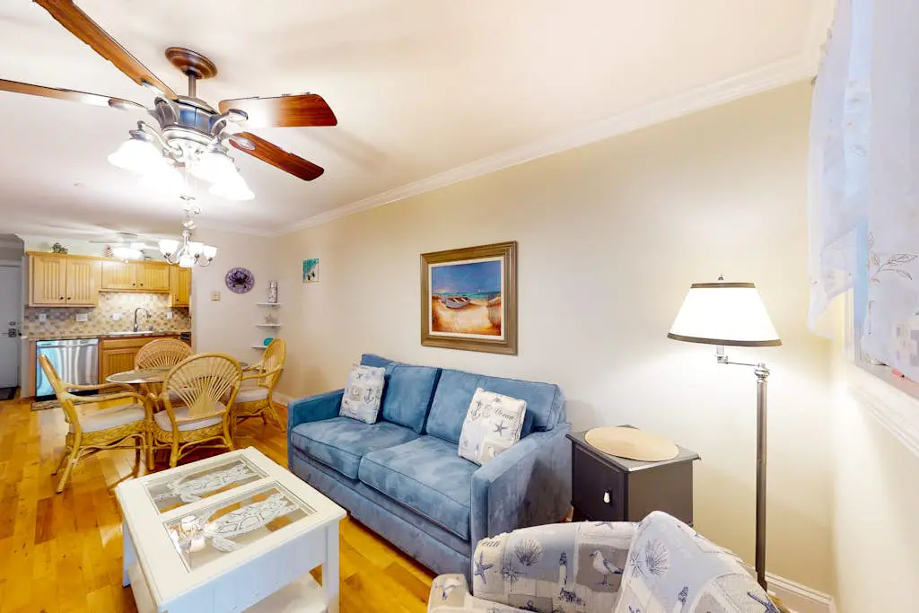 3rd-floor condo with water views, balcony, pools, gym, & beach access