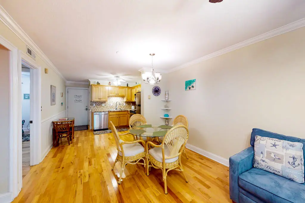 3rd-floor condo with water views, balcony, pools, gym, & beach access