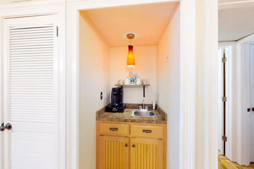 3rd-floor condo with water views, balcony, pools, gym, & beach access