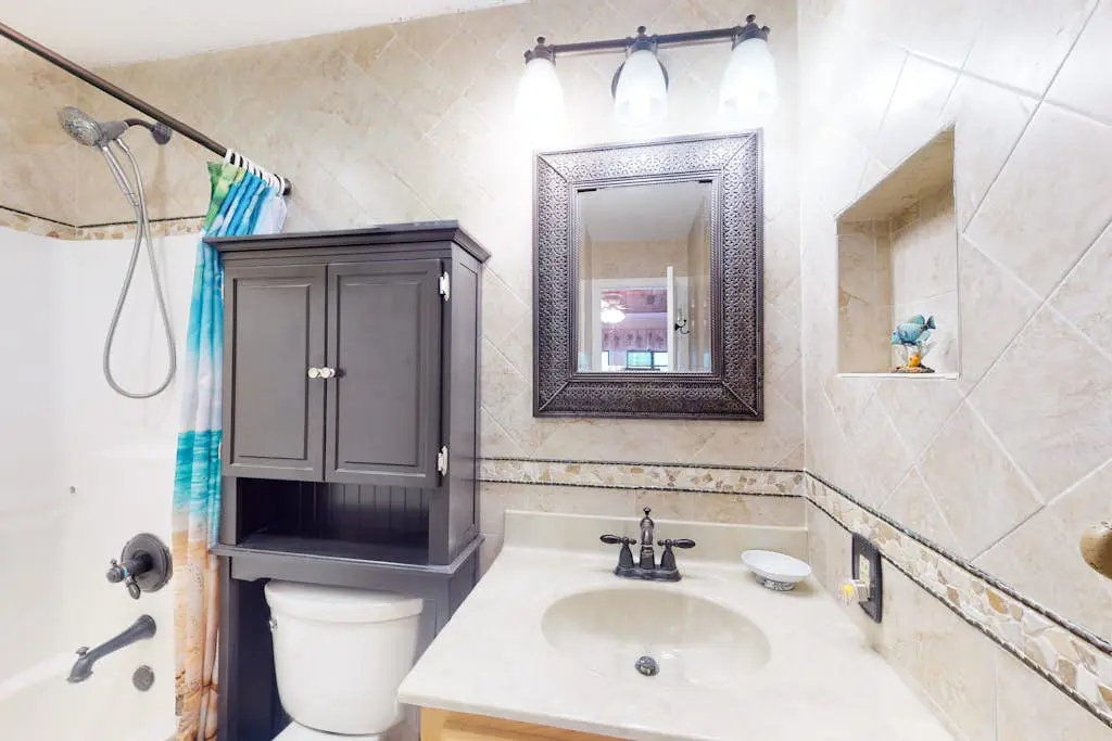 3rd-floor condo with water views, balcony, pools, gym, & beach access