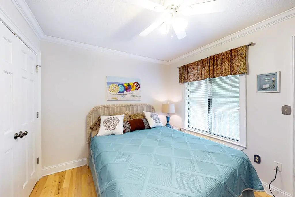 3rd-floor condo with water views, balcony, pools, gym, & beach access