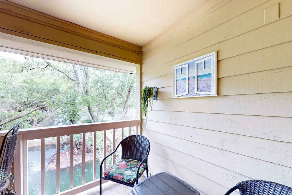 3rd-floor condo with water views, balcony, pools, gym, & beach access