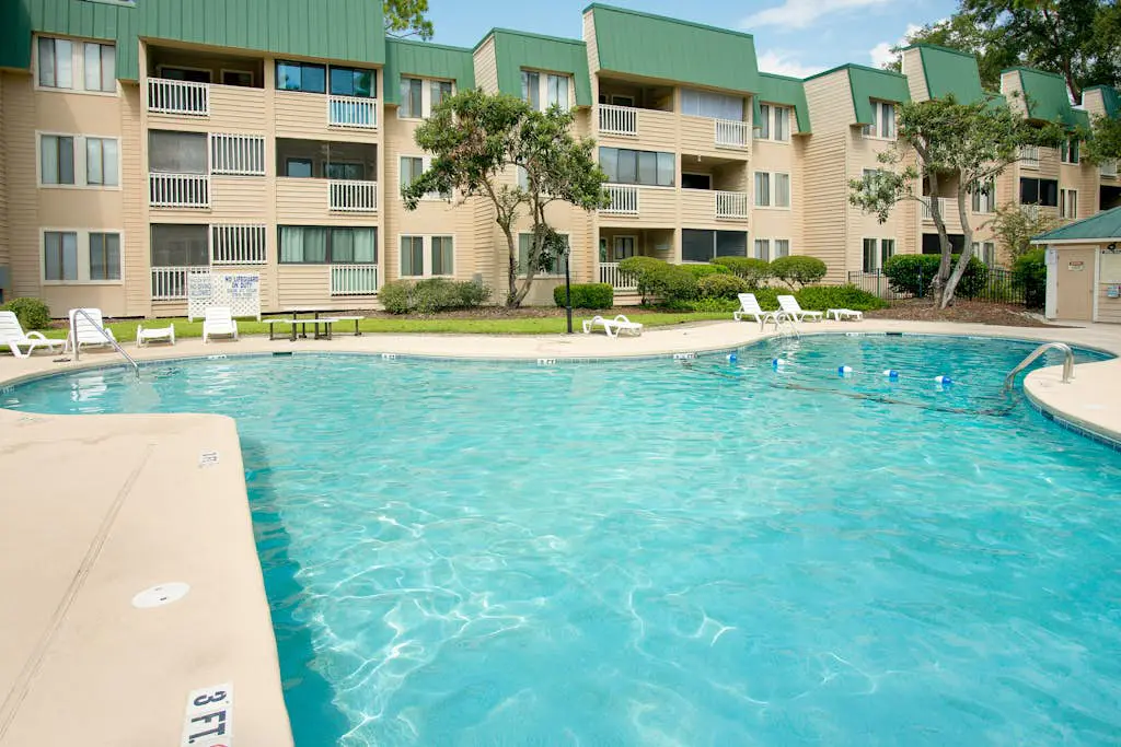 3rd-floor condo with water views, balcony, pools, gym, & beach access