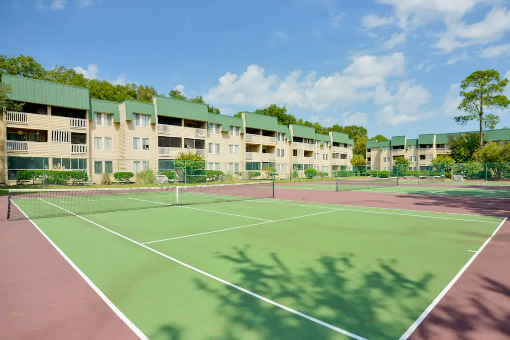 3rd-floor condo with water views, balcony, pools, gym, & beach access