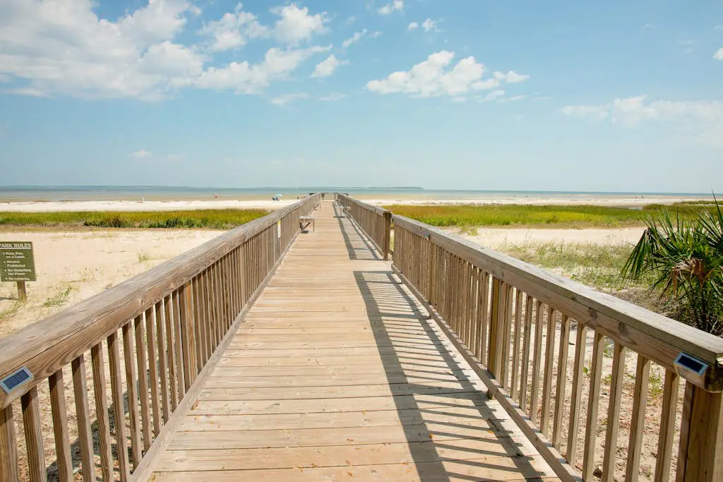 3rd-floor condo with water views, balcony, pools, gym, & beach access